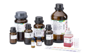 Assorted Chemical Indicator Bottles A variety of chemical bottles in different sizes, including brown glass and plastic containers, all labelled with safety information and branding from Supelco, accompanied by a color chart for reference.