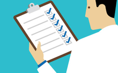 A person in a lab coat looking at a checklist A person in a lab coat looking at a checklist