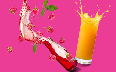 Image featuring a glass of orange juice splashing and a bottle of raspberry juice with berries and mint leaves.
