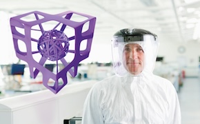 <p>寻找您的滤芯。哪种最适合您的工艺?</p> Person in a lab coat by a purple 3D-printed structure against a bright, clean background.