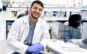 <p>Transforming Pharma Operations with Generative AI: From Data Silos to Intelligent Insights</p>
Scientist wearing a lab coat.