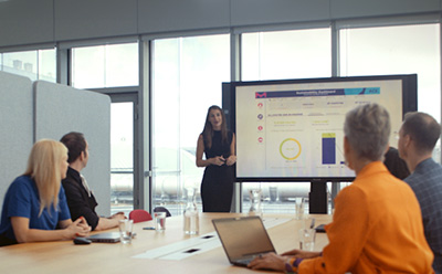 Customer meeting looking at graphs together Customer meeting looking at graphs together