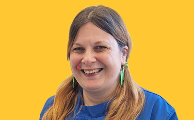 Rae Freestone Rae Freestone headshot on a vibrant yellow background