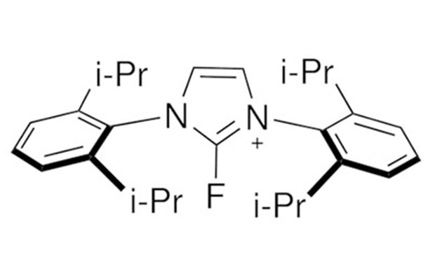 A chemical structure diagram featuring a central nitrogen (N) atom double-bonded to two other nitrogen atoms, each connected to an isopropyl group (i-Pr). The central nitrogen atom also has a positive charge and is single-bonded to a fluorine (F) atom. Flanking the central structure are two benzene rings, each attached to the outer nitrogen atoms.