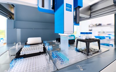 Inside closeup view of the AAW™ workstation deck with plates, pipettes, and gripper for lab automation.