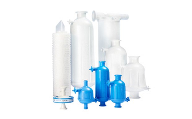 A variety of laboratory filtration devices, including several sizes of filter columns and flasks, used for buffer filtration in scientific research.
