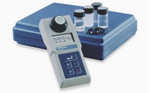 Turbidimeter with vials of liquid and a carrying case.