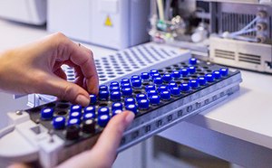 Scientist holding an HPLC chromatogram