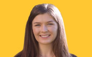 Amber Cook headshot on a vibrant yellow background