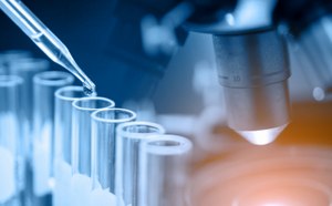 Image showing microscope with lab glassware, science laboratory research and development concept