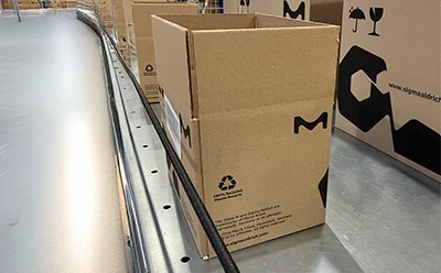 Boxes on conveyor belt, showcasing sustainable forestry-certified packaging at Darmstadt site. Boxes on conveyor belt, showcasing sustainable forestry-certified packaging at Darmstadt site.