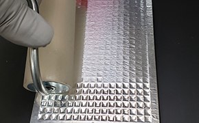 Image of the Aluminum adhesive seal needed for Aurora assay plates read on SMCxPRO® instruments. Do NOT use clear acrylic seals to seal loaded Aurora plates because they do not protect against light.